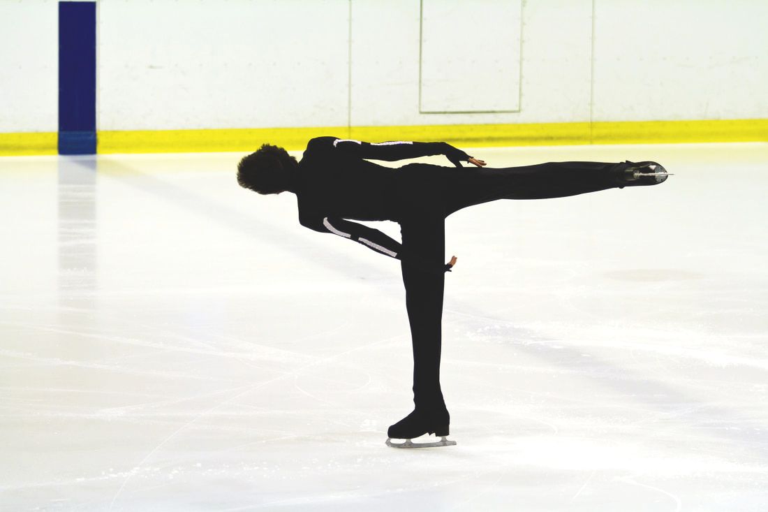 Figure skater doing camel spin on ice